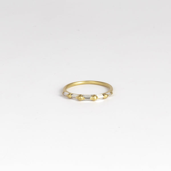 Lexi Diamond band ring by Polly Wales is a  halo band with five tapered baguette diamonds&nbsp;(.33tcw). Cast in Place. Cast not set.