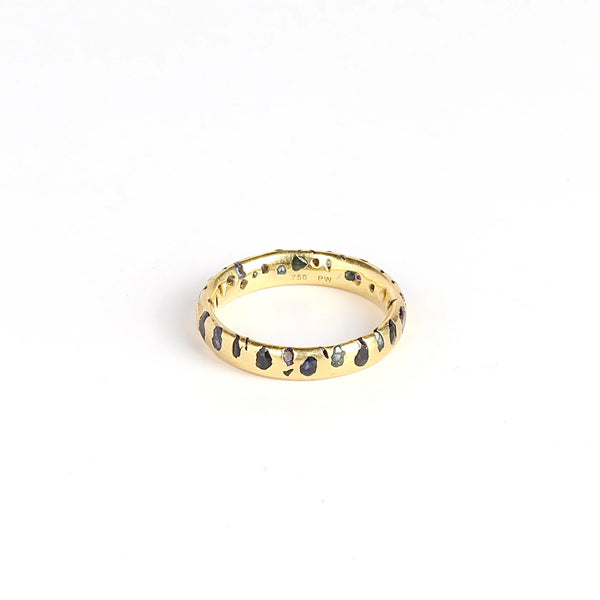 Polly Wales Black with Teal, blue, navy and Purple sapphires Confetti Band in size 7.5 that is Cast not Set on white background.