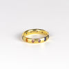 Celeste Ring in Blossom Crush by Polly Wales is a wide 18k recycled yellow gold band with sparkly rainbow sapphires in orange, yellow, green, pink, blue and purple peppered around the circumference. Recycled gold. Cast in Place. Cast not set. Handmade in Los Angeles.