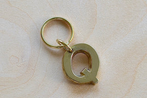 'Q' Letter keyring, key chain, key ring in brass made by Carl Aubock. 