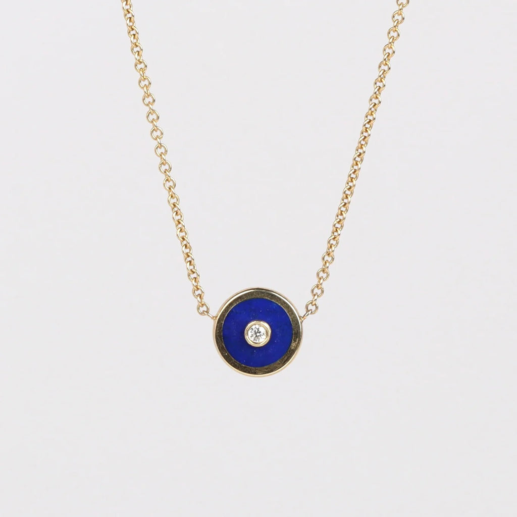 Retrouvai Mini compass pendant in lapis with a center diamond.