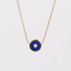 Retrouvai Mini compass pendant in lapis with a center diamond.