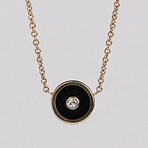 Mini Compass Pendant Necklace in Black Onyx by Retrouvai with round white diamond accent on 16" 14k yellow gold chain.