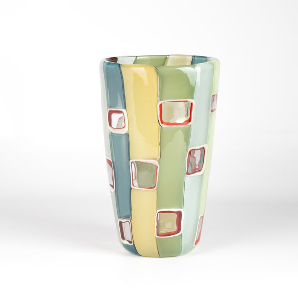Robin Mix Large Cylinder Flat Cane Vase with Windows is a flat cane vase in yellows, blues, greens and aqua with windows by Robin Mix. His sensibilities come from his training in Scandinavia, but is produced using the most sophisticated and iconic of traditional modernist Italian techniques.