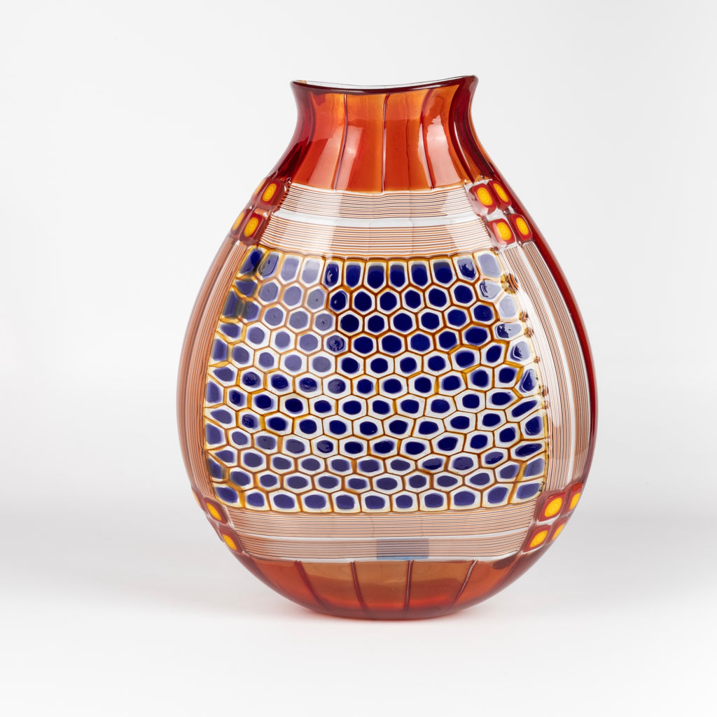 Robin Mix Vintage Vase 11" in deep red with clear glass and blue is a flat cane vase with pezzati and murrini vase by Robin Mix. His sensibilities come from his training in Scandinavia, but is produced using the most sophisticated and iconic of traditional modernist Italian techniques.