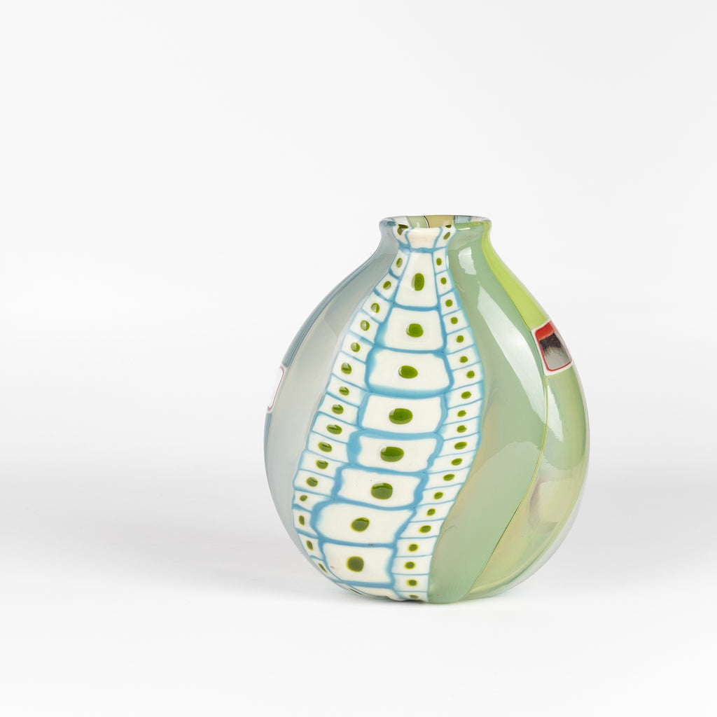 Robin Mix Medium Flat Cane Murrini Vase with Windows 7" is a flat cane vase with Murrini and windows by Robin Mix. His sensibilities come from his training in Scandinavia, but is produced using the most sophisticated and iconic of traditional modernist Italian techniques.
