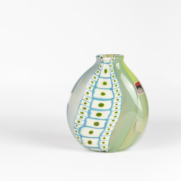 Robin Mix Medium Flat Cane Murrini Vase with Windows 7" is a flat cane vase with Murrini and windows by Robin Mix. His sensibilities come from his training in Scandinavia, but is produced using the most sophisticated and iconic of traditional modernist Italian techniques.
