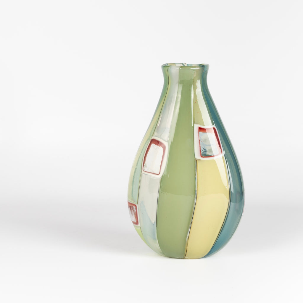 Robin Mix Medium Flat Cane Murrini Vase with Windows 7" is a flat cane vase with Murrini and windows by Robin Mix. His sensibilities come from his training in Scandinavia, but is produced using the most sophisticated and iconic of traditional modernist Italian techniques.