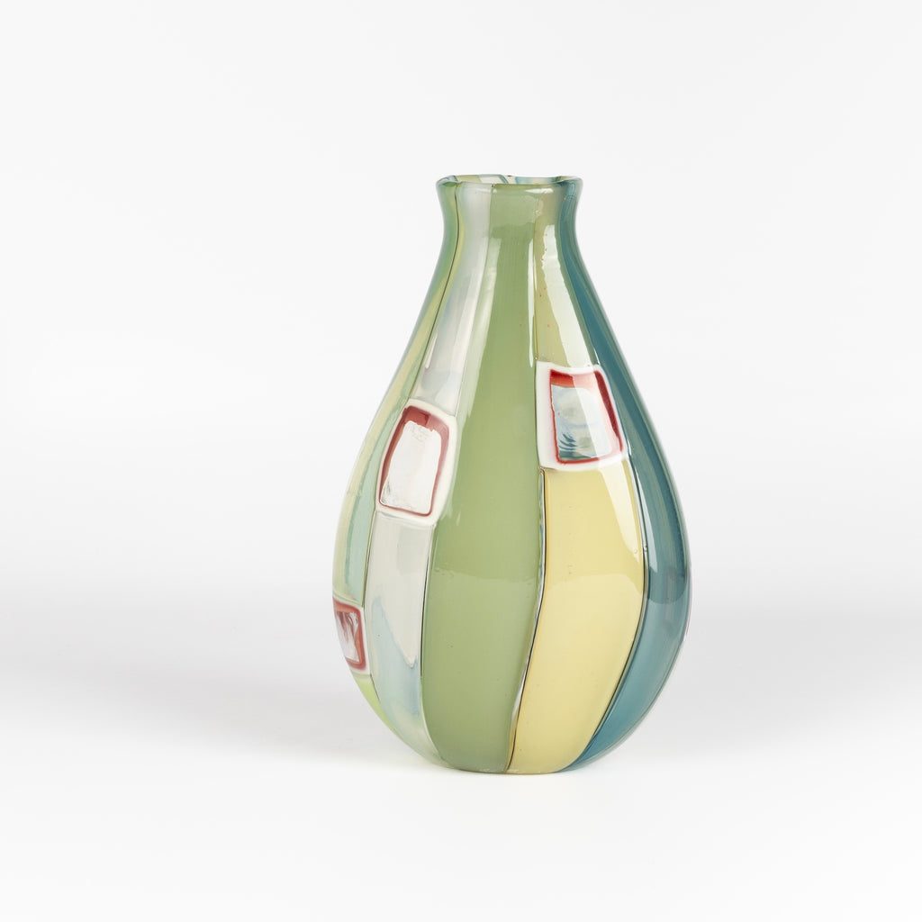 Robin Mix Medium Flat Cane Murrini Vase with Windows 7" is a flat cane vase with Murrini and windows by Robin Mix. His sensibilities come from his training in Scandinavia, but is produced using the most sophisticated and iconic of traditional modernist Italian techniques.
