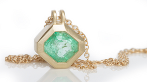 Studio shot of Duo Bale Offset Emerald Necklace by Elizabeth Street.