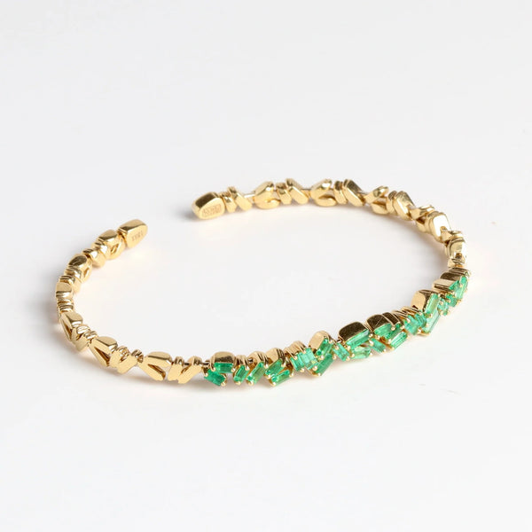 18k Zig Zag Firework Bangle in Emerald by Suzanne Kalan on white background.