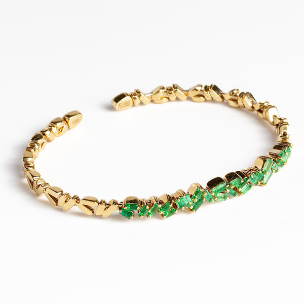 18k Zig Zag Firework Bangle in Emerald by Suzanne Kalan on white background.