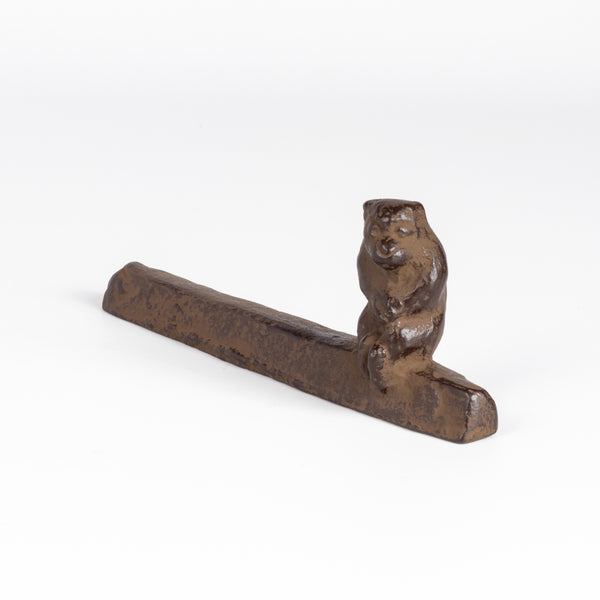 A cast Iron paperweight with a seated monkey by Suzuki Morihisa. Made by the Suzuki Morihisa family, now in its 14th generation, started making Nambu Ironware in 1625. Made in Iwate, Japan.
