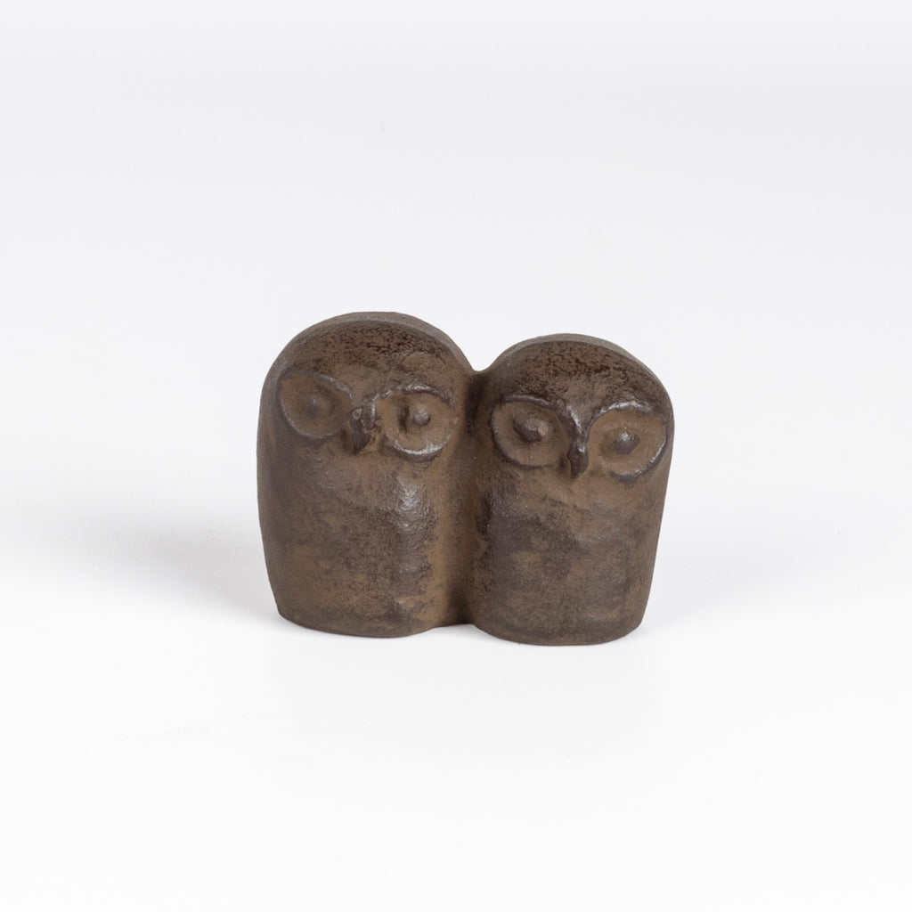 A cast Iron paperweight in the shape of two owls by Suzuki Morihisa. The Suzuki family, now in its 14th generation, started making Nambu Ironware in 1625. Made in Iwate, Japan.