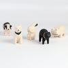 T-lab wooden animals are handmade in Bali from albizia wood, a lightweight fast-growing wood from the South Pacific. A dog, black cat, speckled cow, rabbit and hippo and cow.