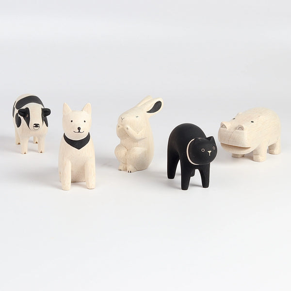 T-lab wooden animals are handmade in Bali from albizia wood, a lightweight fast-growing wood from the South Pacific. A dog, black cat, speckled cow, rabbit and hippo and cow.