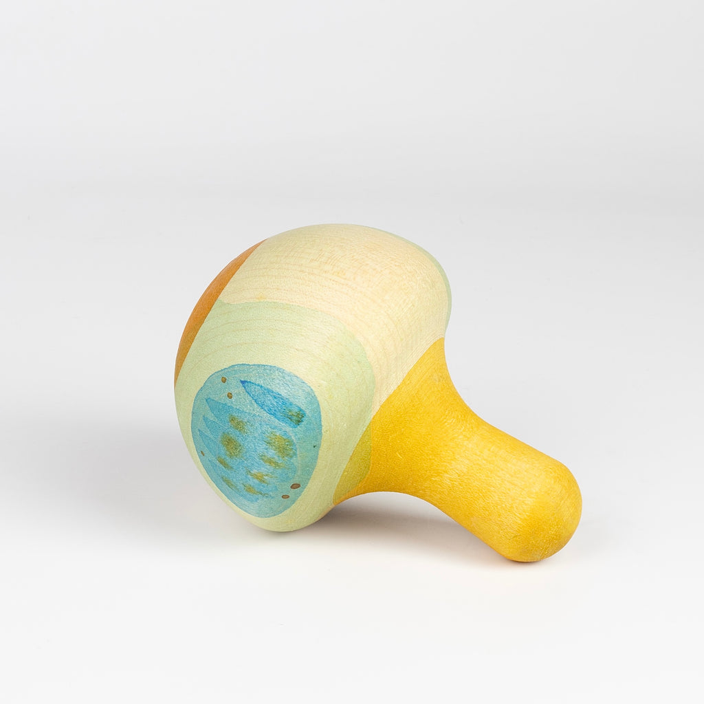 Grapat Bird Rocking Toy in wood on its side.