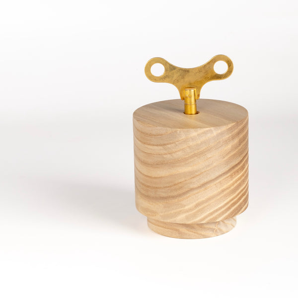 A wind up music box imade by a family run business in the Black Forest, Germany. A mechanical 18-note chime mechanism is inserted into solid wood, carved into this shape. It continually plays a 2 minute excerpt from "Waltz of the Flowers" and the Nutcracker Suite by Tchaikovsky.