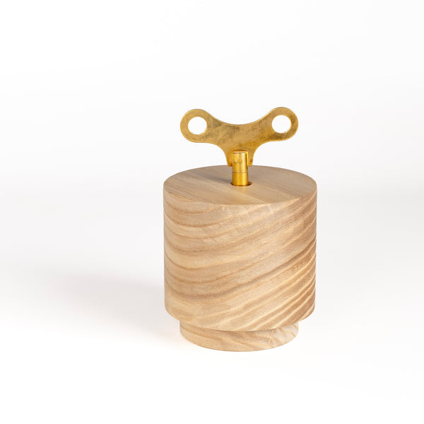 A wind up music box imade by a family run business in the Black Forest, Germany. A mechanical 18-note chime mechanism is inserted into solid wood, carved into this shape. It continually plays a 2 minute excerpt from "Waltz of the Flowers" and the Nutcracker Suite by Tchaikovsky.