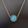 Retrouvai Mini compass pendant in turquoise.