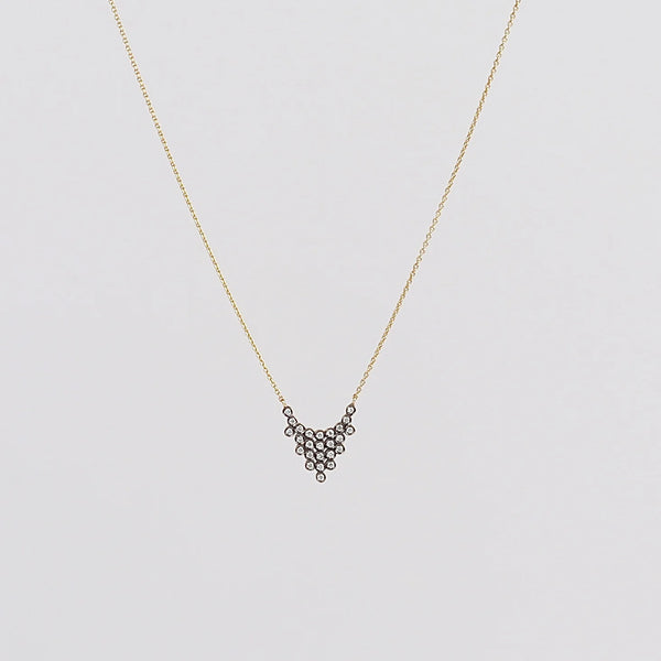 Charnières Pétale Pendant Necklace by Yannis Sergakis is twenty-Five (25) rhodium plated round cut diamonds that form a triangular pendant on an 18k gold chain.