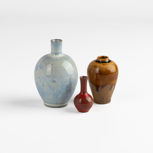 Miniature Hand Thrown Ceramic trio of vases by Yuta Segawa. One cloud blue with perferations, one brown and one reddish brown to bordeaux.