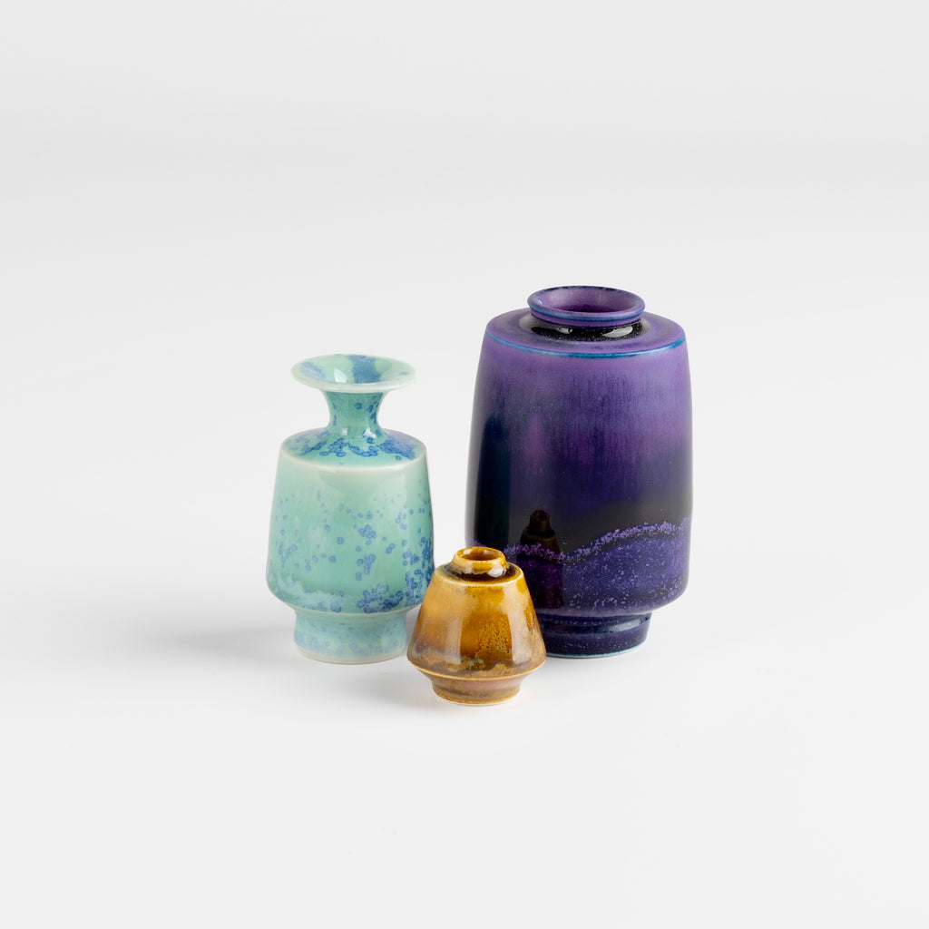 Miniature Hand Thrown Ceramic trio of vases by Yuta Segawa. One turquoise with purple spots, one brown and one purple with perforations.