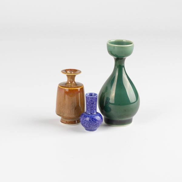 Miniature Hand Thrown Ceramic trio of vases by Yuta Segawa. One tall green, one brown and one purple with speckled spots.