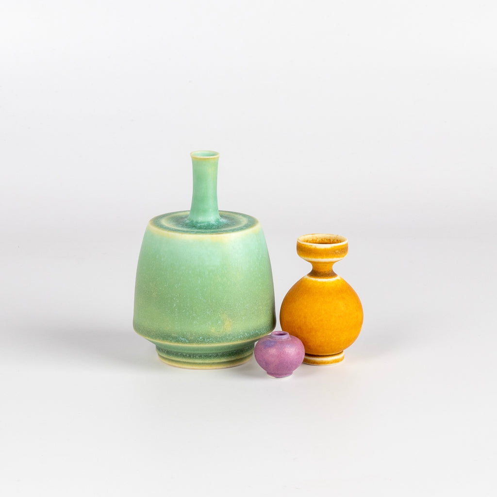 Miniature Hand Thrown Ceramic Vase Trio "C" in Aqua Green, Orange and Lilac by Yuta Segawa on White background.