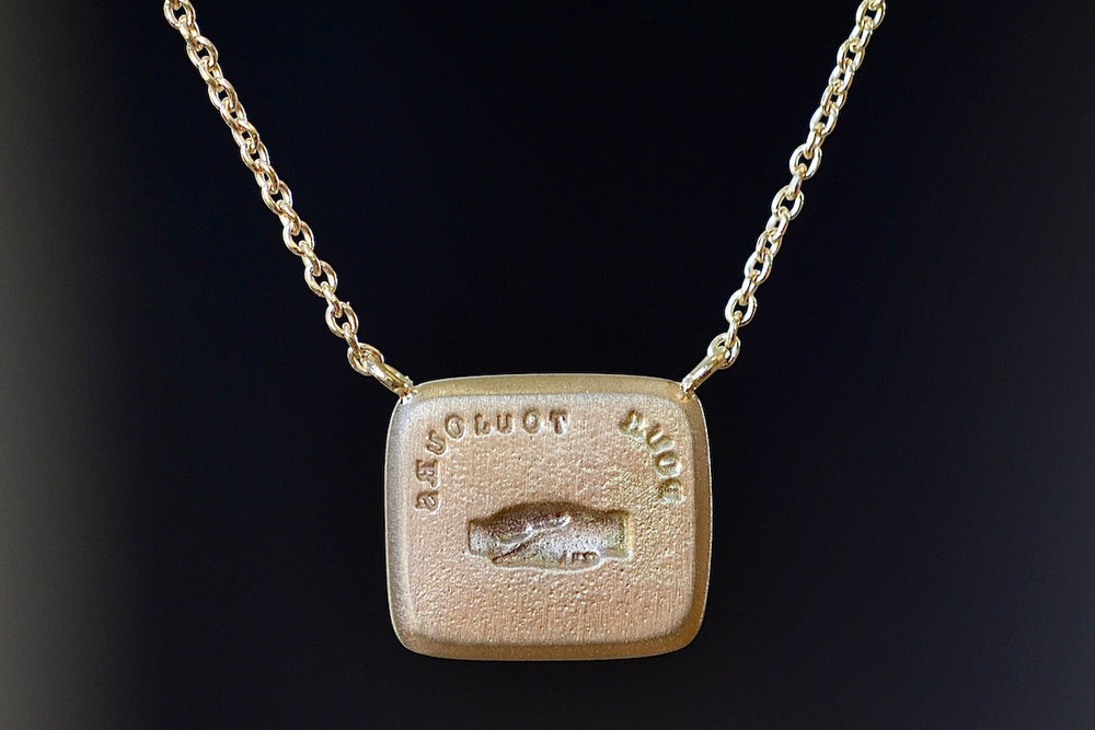 Such is Life / Forever Duo Motto Necklace designed by Makita Wakita showing the back side. Clasped hands are the universal image for friendship, peace, alliance, unification, and partnership… Shake to a promise of “promise.”