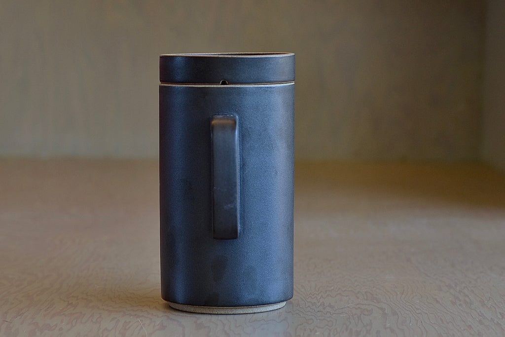 Showing the tall Hasami porcelain teapot in black from the back.