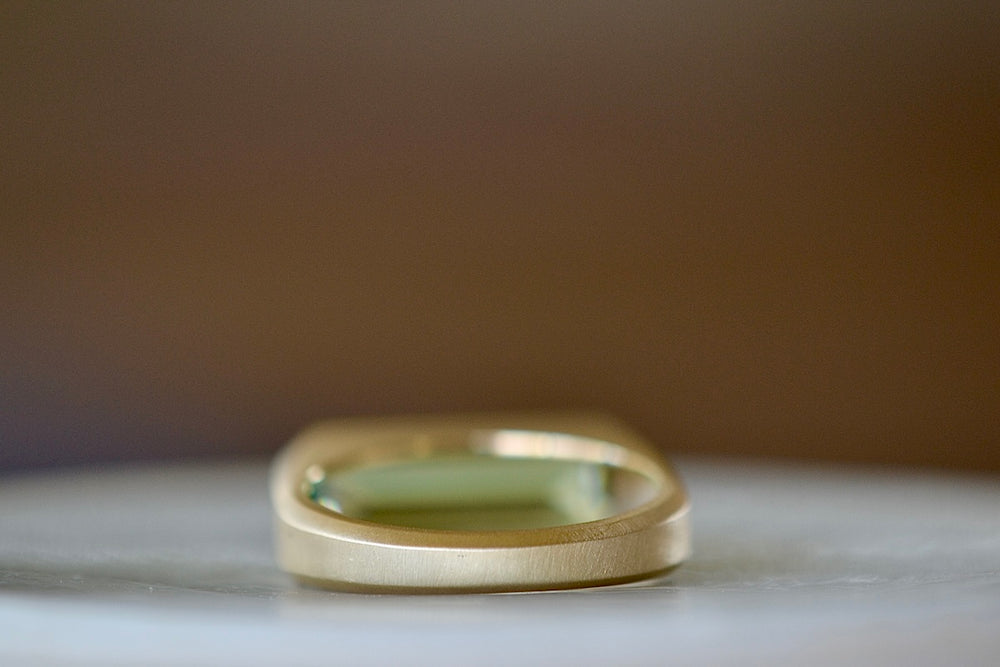 Back view of brushed 14k gold band on Peridot bar signet ring by Elizabeth Street Jewelry.