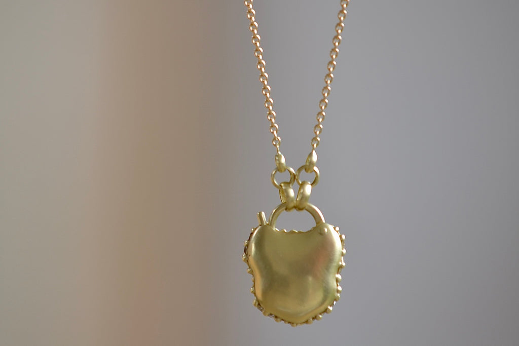 Showing the Small River Diamond Baguette Fuzzy Pave "Petite Coeur de Fantasie" Padlock Necklace designed by Polly Wales from the back.