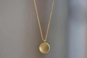 Back of Pastel Blossom River Domed Necklace designed by Polly Wales. Recycled gold.