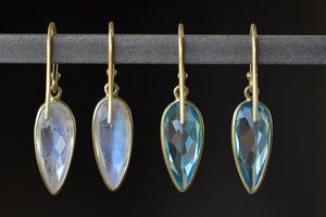 Medium leaf earrings in rainbow moonstone and blue topaz by Tej Kothari shown from the back.