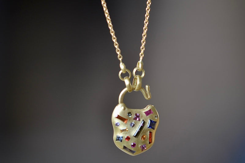 Click mechanism on Small Harlequin Coeur de Confetti Padlock Necklace by Polly Wales.