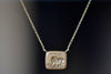 Lion and Mouse Duo Motto Necklace in 18k gold is a rectangular disc in gold with satin finish that will turn shiny over time features an image from the Aesop Fable ‘The Lion and the Mouse featuring the words 'patience". Made by stamping an 1800s carved seal with 'mottos' in French, Italian, Latin or English on to gold. 