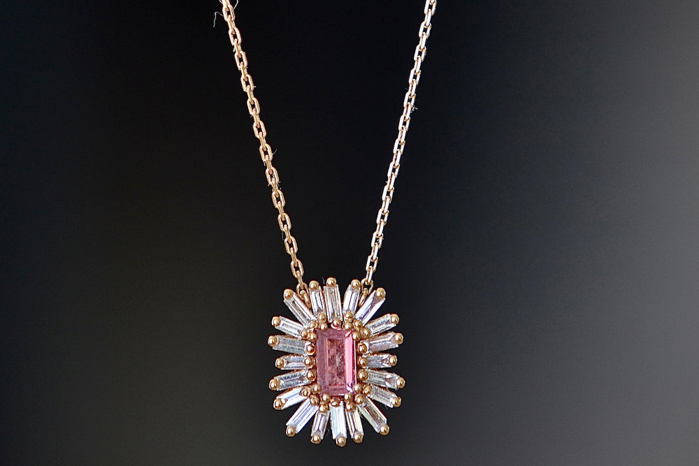 Close up of Suzanne Kalan Pink Sapphire Necklace with Diamond Baguette Halo.