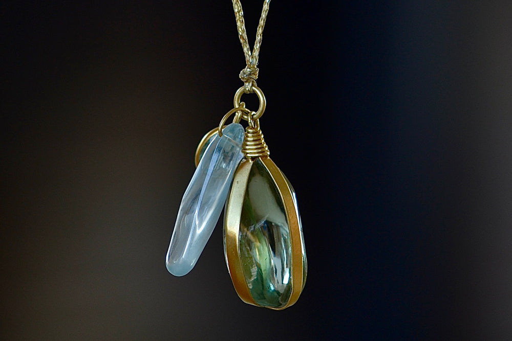Close up of Three Stone Parcel Set Necklace in Aquamarine by Pippa Small.