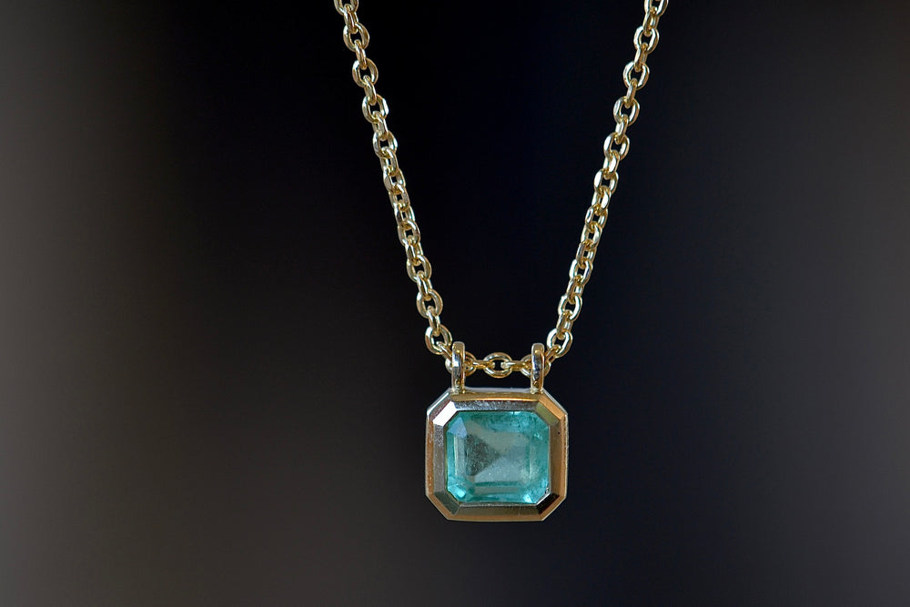 Close up of Duo Bale Emerald Necklace by Elizabeth Street Jewelry.