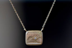 I will Return duo Motto necklace by Makita Wakita is a Made by stamping an 1800s carved seal with 'mottos' in French, Italian, Latin or English on to gold. A rectangular disc in gold and an accent diamond on the front with satin finish that will turn shiny over time. 18" and 18k yellow gold.