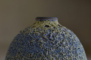 Detail of Heather Rosenman Short Blue with Yellow Volcanic Vase.