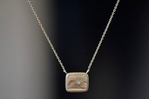 I will Return duo Motto necklace by Makita Wakita is a Made by stamping an 1800s carved seal with 'mottos' in French, Italian, Latin or English on to gold. A rectangular disc in gold and an accent diamond on the front with satin finish that will turn shiny over time. 18" and 18k yellow gold.