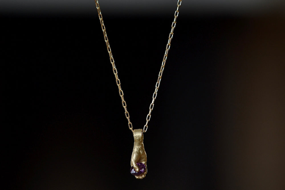 Hand pendant with magenta sapphire by Fraiser Hamilton.