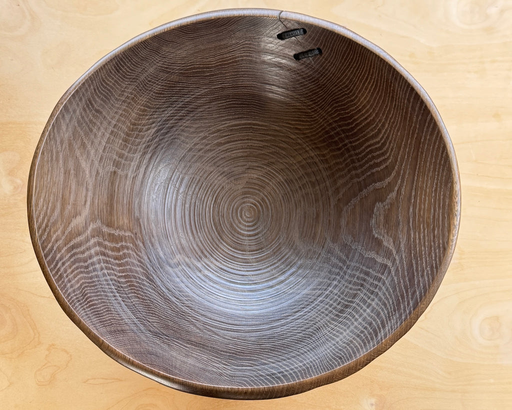 Inside of big turned wood Circle Factory Bowl in Brown Oak With Ridges and Repair Detail by George Petersen.