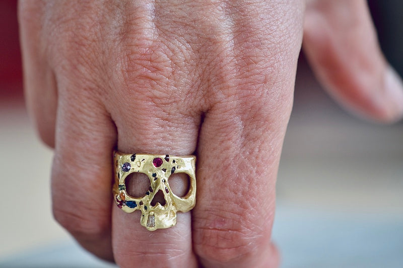 
            
                Load image into Gallery viewer, Wearing the Polly Wales Rainbow confetti skull ring.
            
        