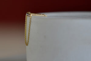 Side view of bar and chain earrings.