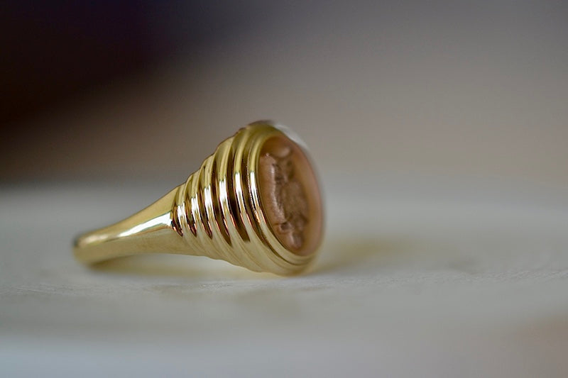 
            
                Load image into Gallery viewer, Side view of the tiering on the Retrouvai Baby Fantasy Signet pinky ring in Flying Owl.
            
        