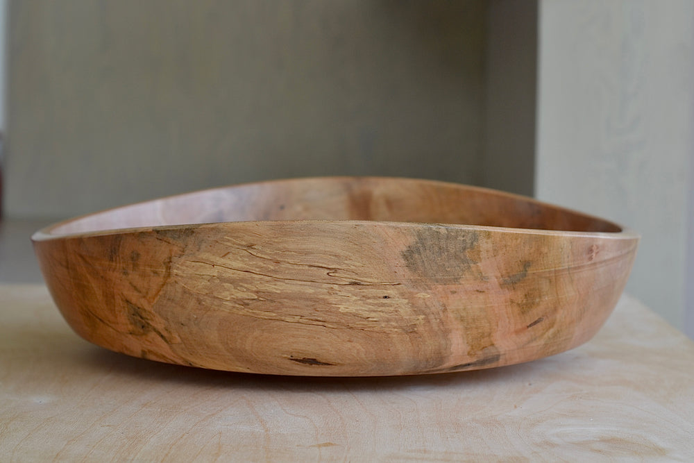 Side view of Circle Factory Bowl in Natural Maple.