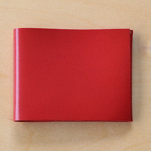 Simple flap wallet by Alice Park in red is perfect fit for dollar bills with space for cards.